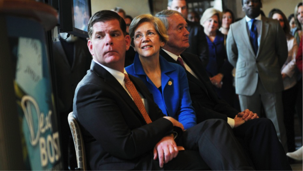  (From left) Boston Mayor Martin J. Walsh, Sen. Elizabeth Warren, and Sen. Edward Markey attend an opening for a new Boston Marathon memorial exhibition at the Boston Public Library on April 7, 2014.(Darren McCollester/Getty Images)